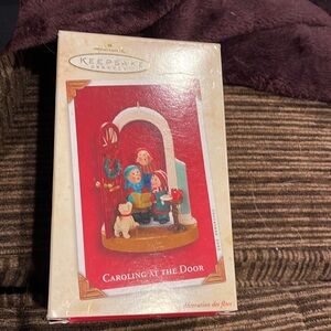 Hallmark Keepsake 2003 Ornament with Box Caroling at the Door Artist Sue…